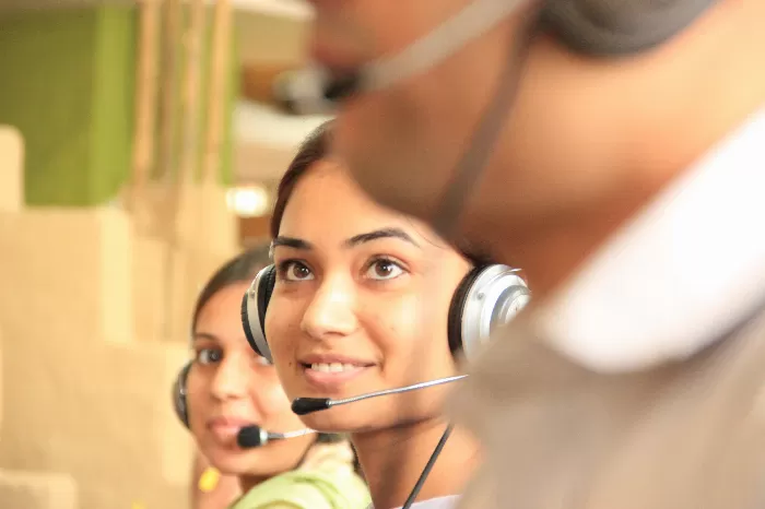 a young woman taking part in a customer service apprenticeship.